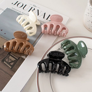 Glossy large shark hair clips in five colors including cream pink and dark green