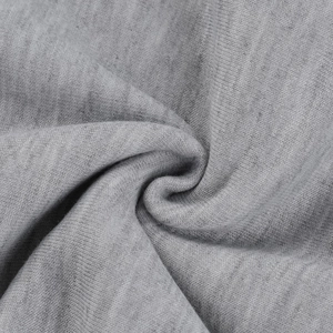 Close-up of grey cotton knit fabric showing soft texture and detailed weave patterns