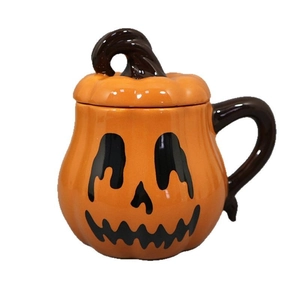 Creative Halloween pumpkin ceramic mug with Jack-o'-lantern face and lid on white background