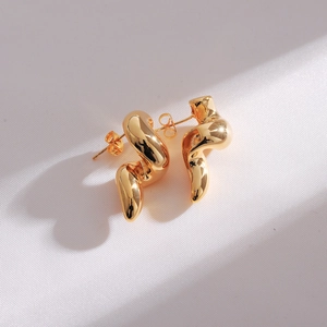 Detailed view of luxury gold double-layer teardrop earrings with a streamlined design