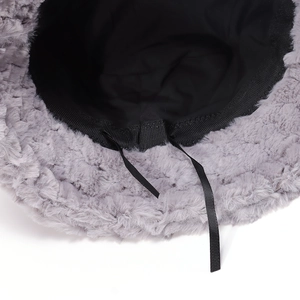 Solid color plush bucket hat with warm faux fur texture and adjustable inner ribbon