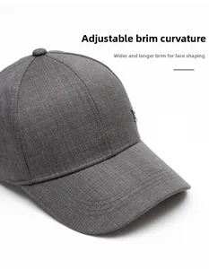 Detail of grey winter baseball cap showing textured fabric and curved reinforced brim