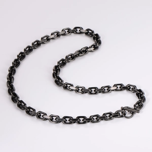 Detail of stainless steel O-chain necklace with OT buckle in a sleek S-curve layout