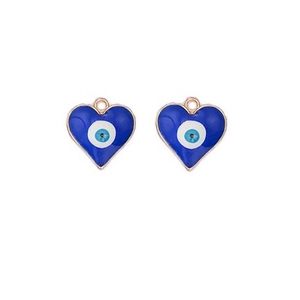 Close-up of blue heart-shaped evil eye charms with golden frames and enamel detail