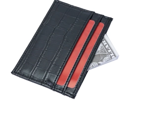 Detailed view of slim black crocodile pattern card holder with multiple credit card slots