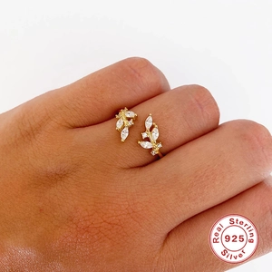 Detail showing an adjustable gold plated S925 silver ring with leaf shaped zircons