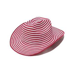 Detail of red and white striped straw cowboy hat with a wide brim for sun protection