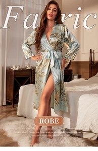 Close-up of floral light blue satin robe featuring elegant belt and premium fabric texture