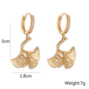 Detail view of gold ginkgo leaf earrings with zircon inlay showing 3cm by 1.8cm dimensions