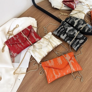 Crossbody envelope bags in crocodile texture with gold chain straps in multiple colors