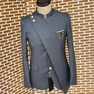 Grey plus-size men's suit with gold chain brooch and asymmetric stand collar