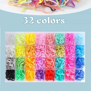 Close-up of 32 colors elastic hair bands organized in a transparent multi-grid storage box