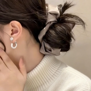 Elegant silver pearl drop earrings with silk scrunchie set shown on a model