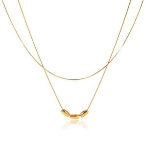 Detail of 18K gold plated double layer necklace with snake chain and small gold beads