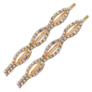 Detail of two gold metal hair clips with colorful rhinestones in a wavy design