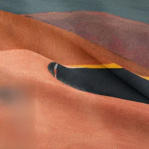 Close-up of bohemian wall tapestry showing thick fabric texture and warm abstract desert art