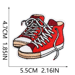 Close-up of red canvas sneaker embroidery patch with detailed stitching and dimensions