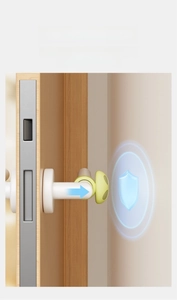 Silicone door handle bumper showing soft hemispherical buffer installed for wall protection