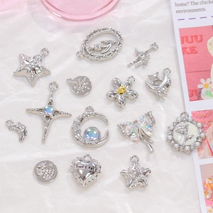 Silver alloy charms set with stars, bows and crosses for DIY jewelry making and crafts