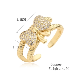Detailed view of gold bow ring dimensions and 4.5g weight specifications on white background
