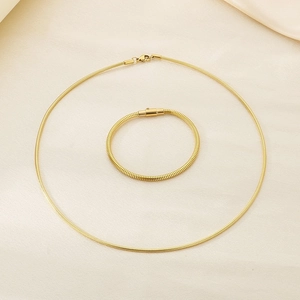Detail of 18K gold plated stainless steel snake chain necklace and matching bracelet set