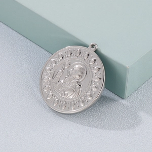 Vintage stainless steel exorcist pendant featuring Saint Benedict religious relief