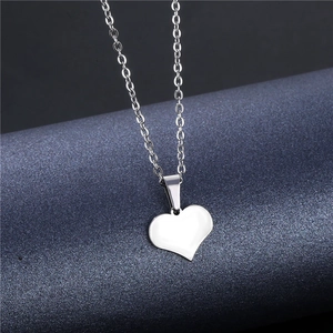 Minimalist silver heart pendant necklace with polished finish and delicate link chain