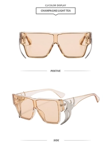 Detail of champagne oversized sunglasses with silver flame-shaped metal temple accents