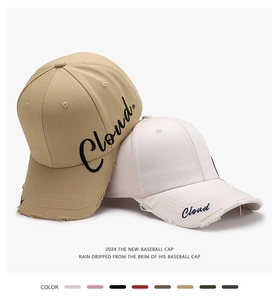 Detailed embroidery on a vintage distressed baseball cap with raw edge brim texture