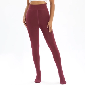 Detail view of high waisted burgundy thermal leggings showing tummy control and seamless fit