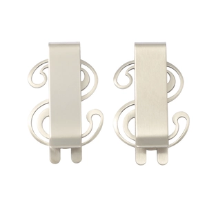Close-up of dual matte silver stainless steel dollar sign money clips with brushed texture