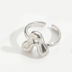 Polished silver adjustable ring featuring a unique stylized clover letter design