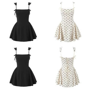 Sleeveless high waist cocktail dress with back lace-up detail in black and polka dot
