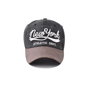 Close-up of New York 3D embroidery on washed cotton baseball cap with contrast brim