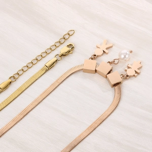 Flat snake chain necklace with boy, girl and pearl charms in gold and rose gold finish