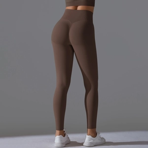 Close-up of high-waisted coffee brown yoga pants with ruched butt lifting seam detail