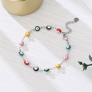 Close-up of colorful evil eye beads on a silver adjustable chain with lobster clasp