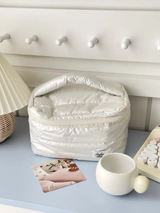 White quilted waterproof cosmetic bag with wide handle and large capacity for travel