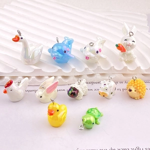 Detail shot of cute resin animal charms with iridescent pearl finish for DIY jewelry