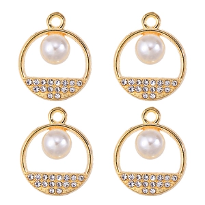 Macro shot of gold pendants featuring embedded pearls and zircon stones for DIY jewelry