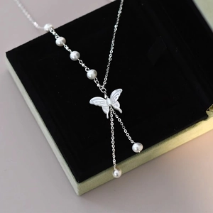 Elegant white butterfly shell necklace with fresh water pearls and silver chain detail