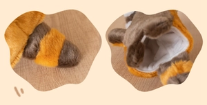 Detail of soft brown striped plush hand puppet fabric and durable white textile lining