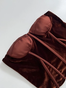 Detailed view of brown velvet corset top with supportive boning and luxury finish