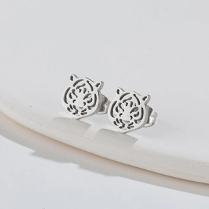 Silver hollow tiger head stud earrings with minimalist laser-cut stainless steel design