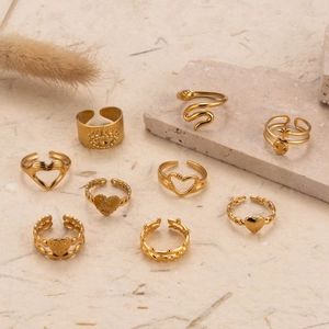 Adjustable gold stainless steel ring set featuring vintage heart and snake designs
