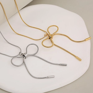 Elegant gold and silver bow pendant necklaces with stainless steel snake chain link