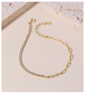 Detail of gold asymmetric bracelet with micro-paved diamonds and paperclip chain links