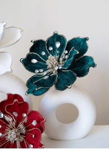 Detail of velvet magnolia flowers with gold glitter edges and crystal beads for Christmas