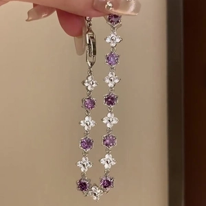Elegant zircon flower bracelet featuring purple hexagons and white blossoms with silver clasp