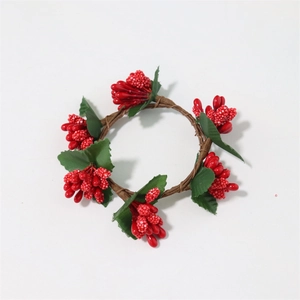 Mini Christmas wreath with red berries and green leaves on brown rattan for napkin rings